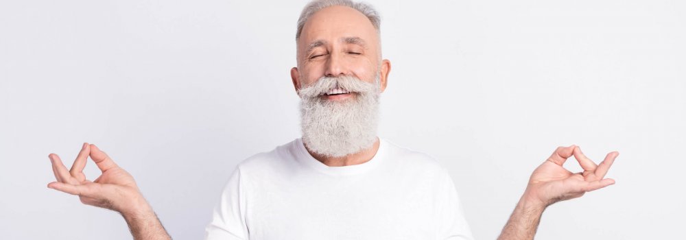 Portrait of positive grey hair beard old man crossed fingers wear white t-shirt isolated on grey color background